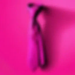 Close-up view of a neon pink tie against a neutral background, showcasing its vibrant color and texture.