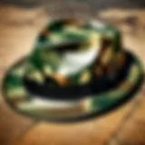 A vintage camouflage fedora hat displayed on a rustic wooden table.